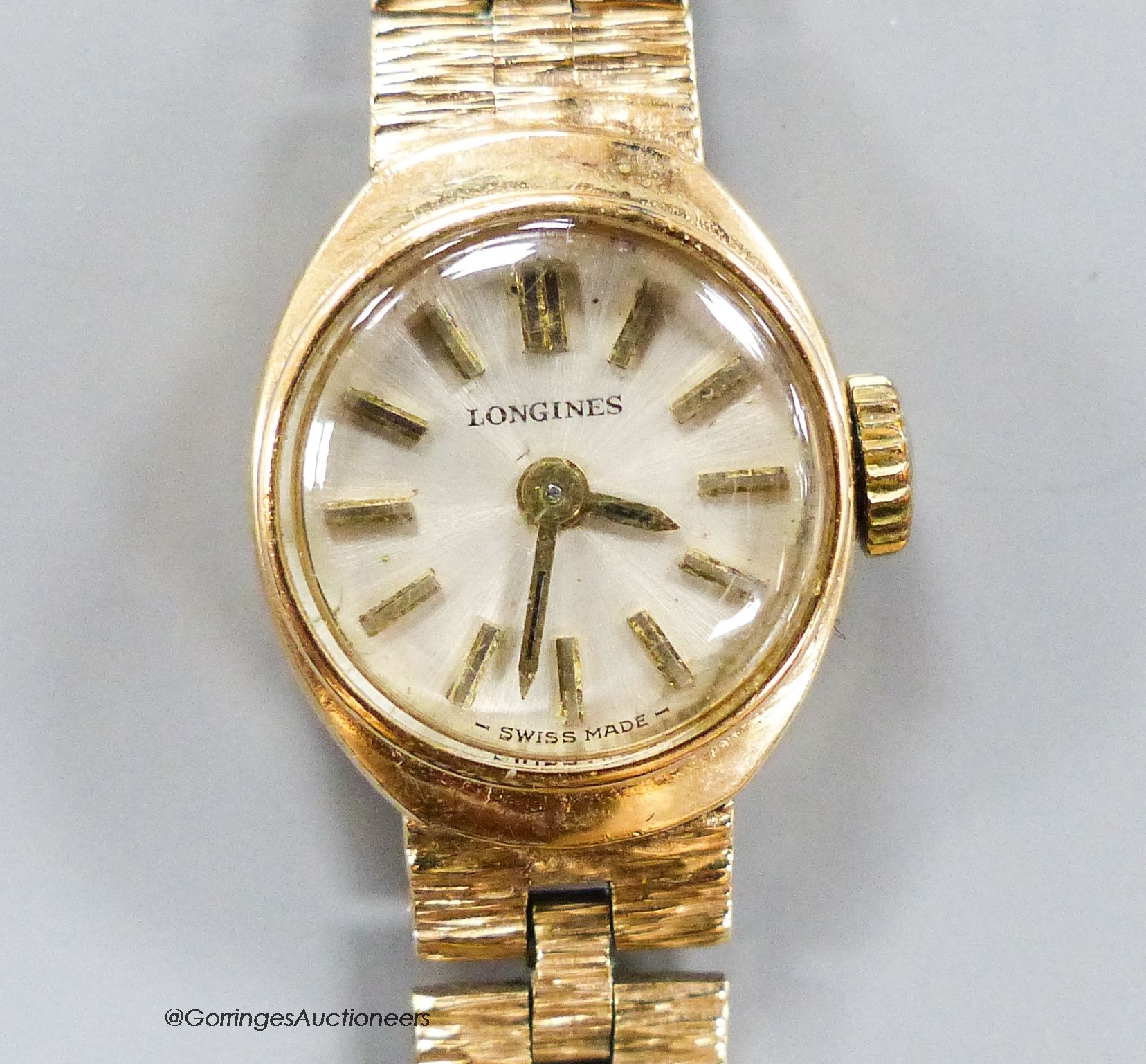 A lady's 9ct gold Longines wristwatch, overall 18.5cm, gross 18.5 grams.
